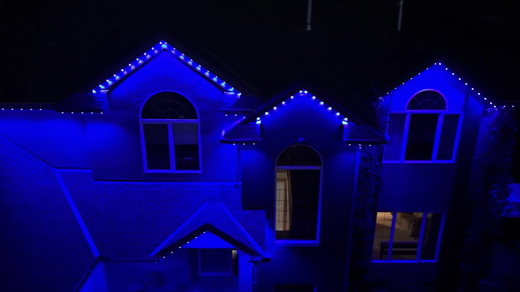 The same house lit in blue