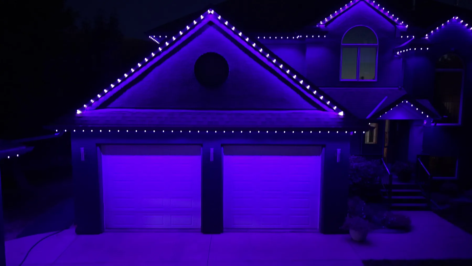 The same house lit in violet